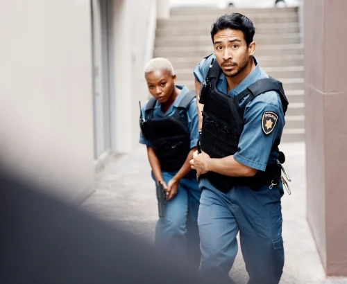 asian-man-police-and-gun-in-city-alley-for-suspec-2025-04-06-08-15-19-utc